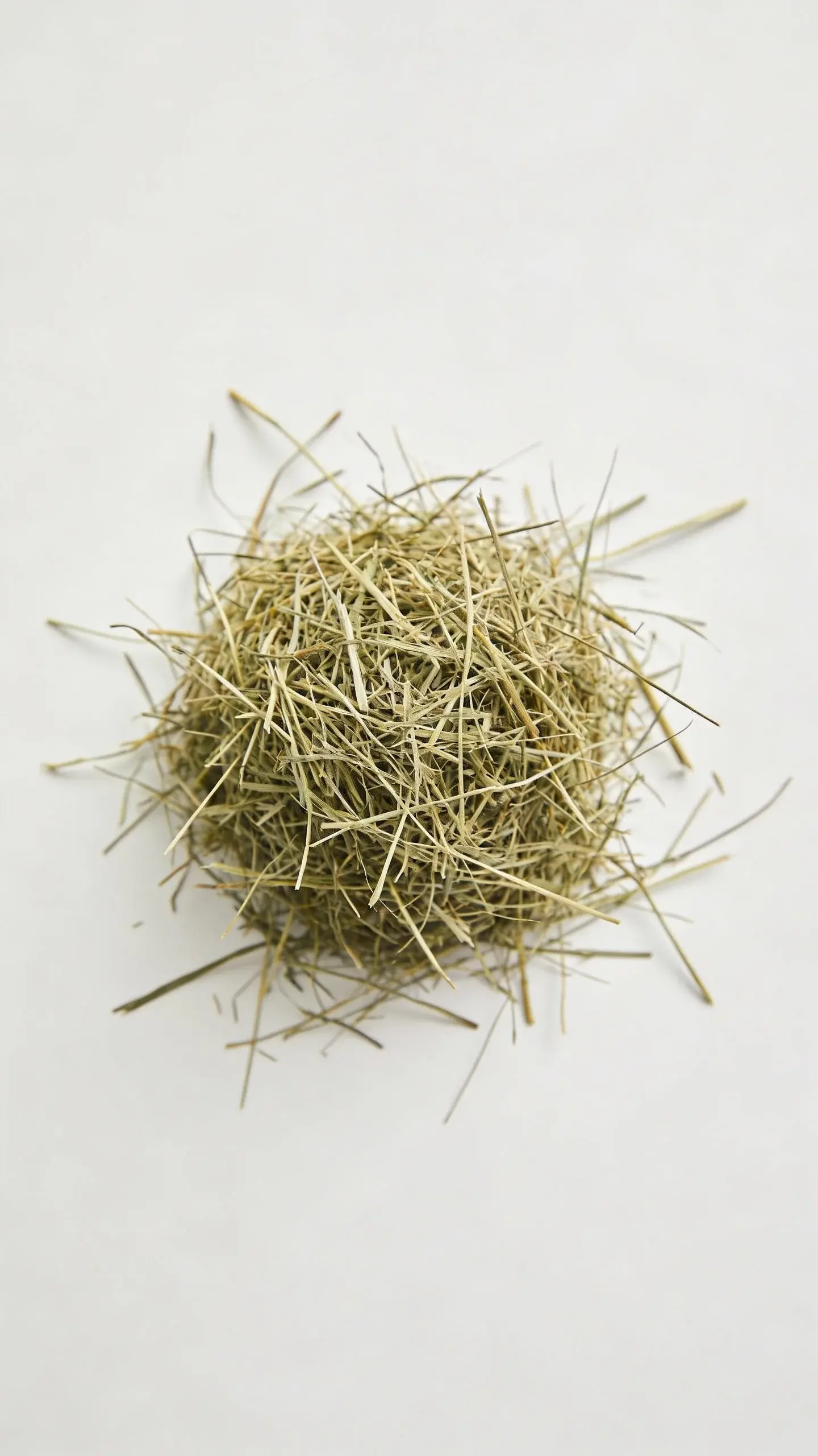 top view of a lone timothy hay pile on white background