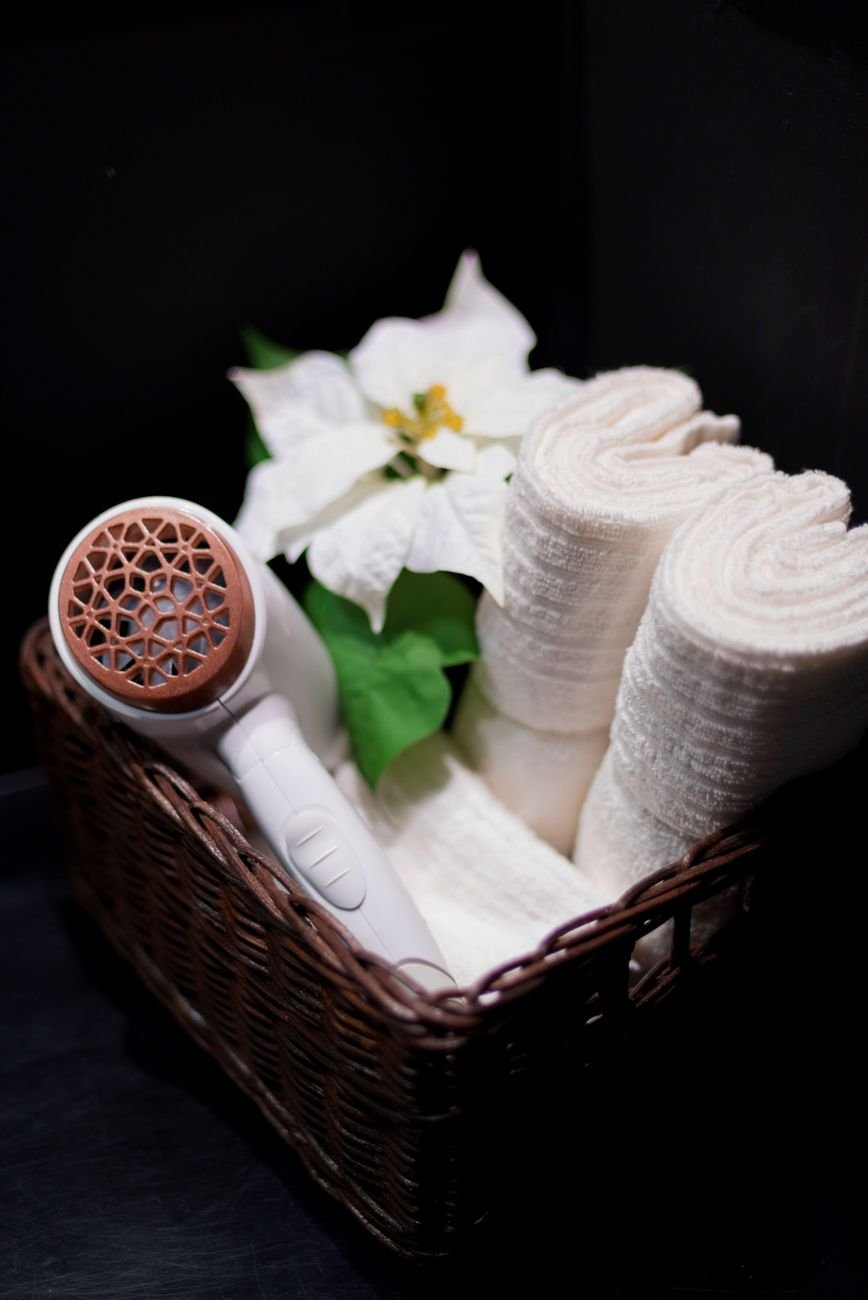 Rolled towels stacked in a basket
