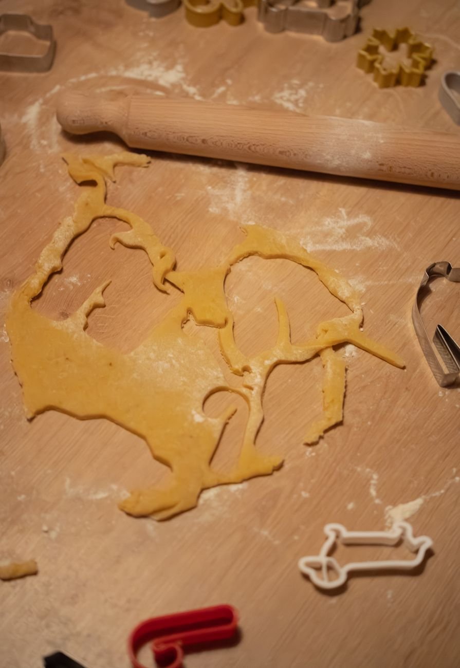 Dough being rolled out and cut into shapes