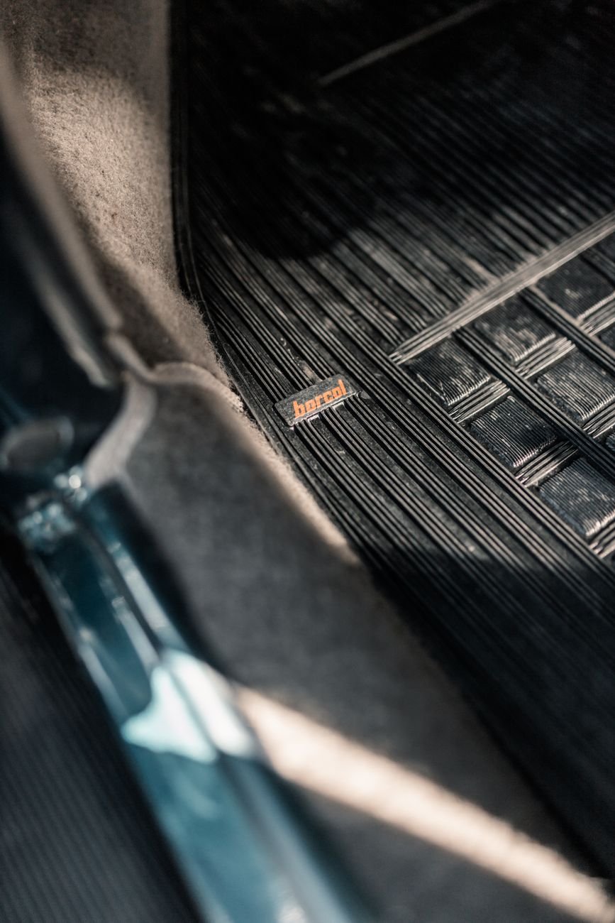 Clean car floor mats outside the car