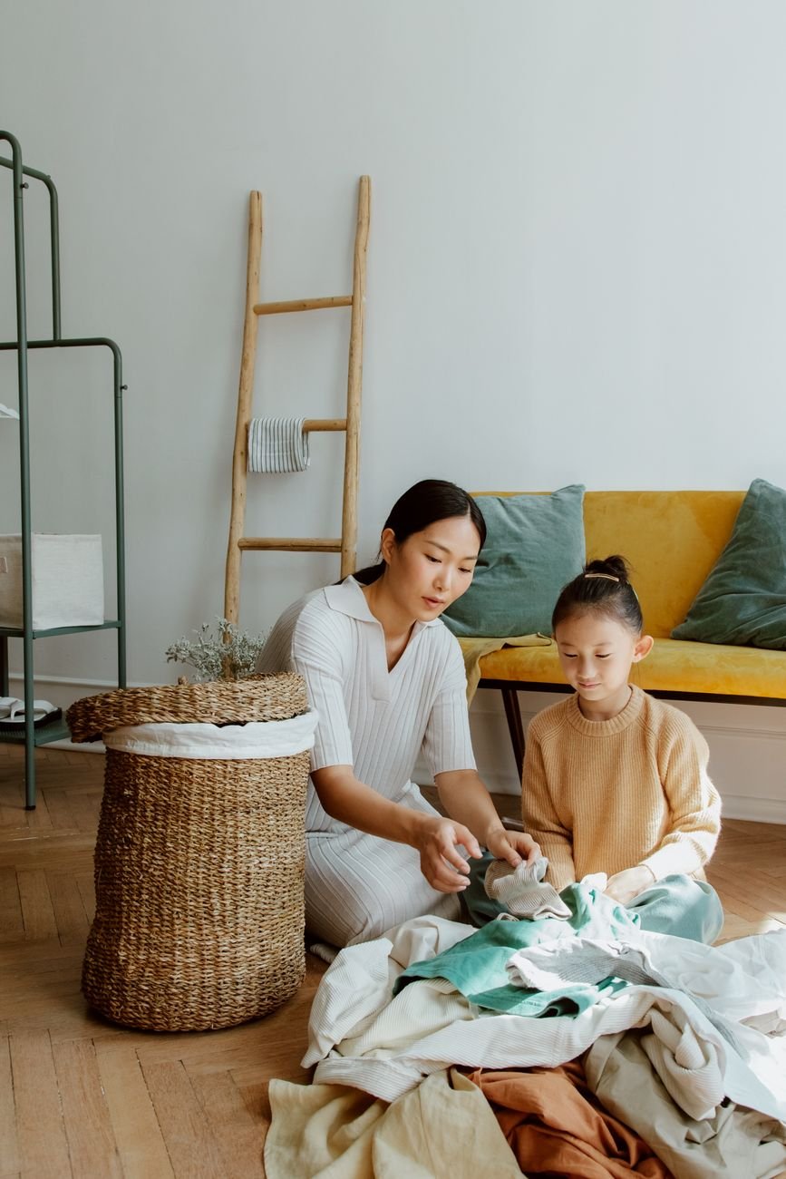 A child helping fold laundry