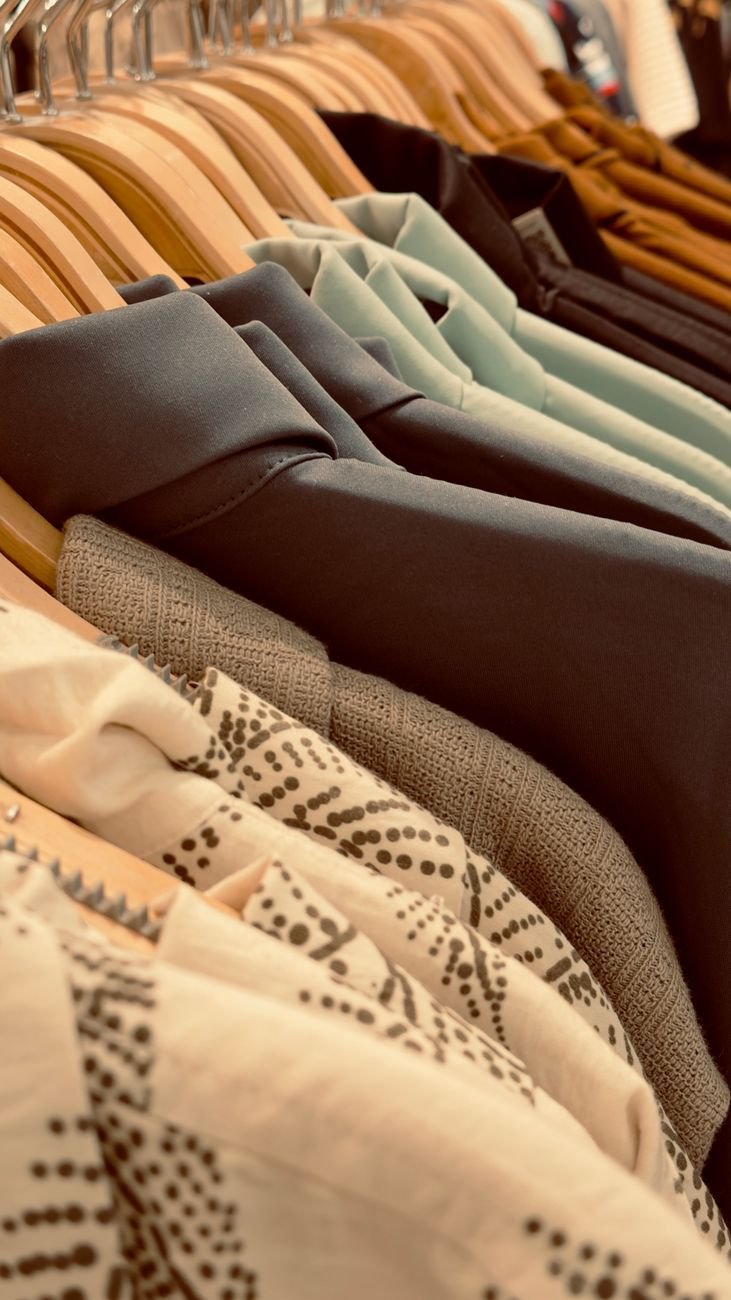 Clothes on matching slim hangers in a small closet