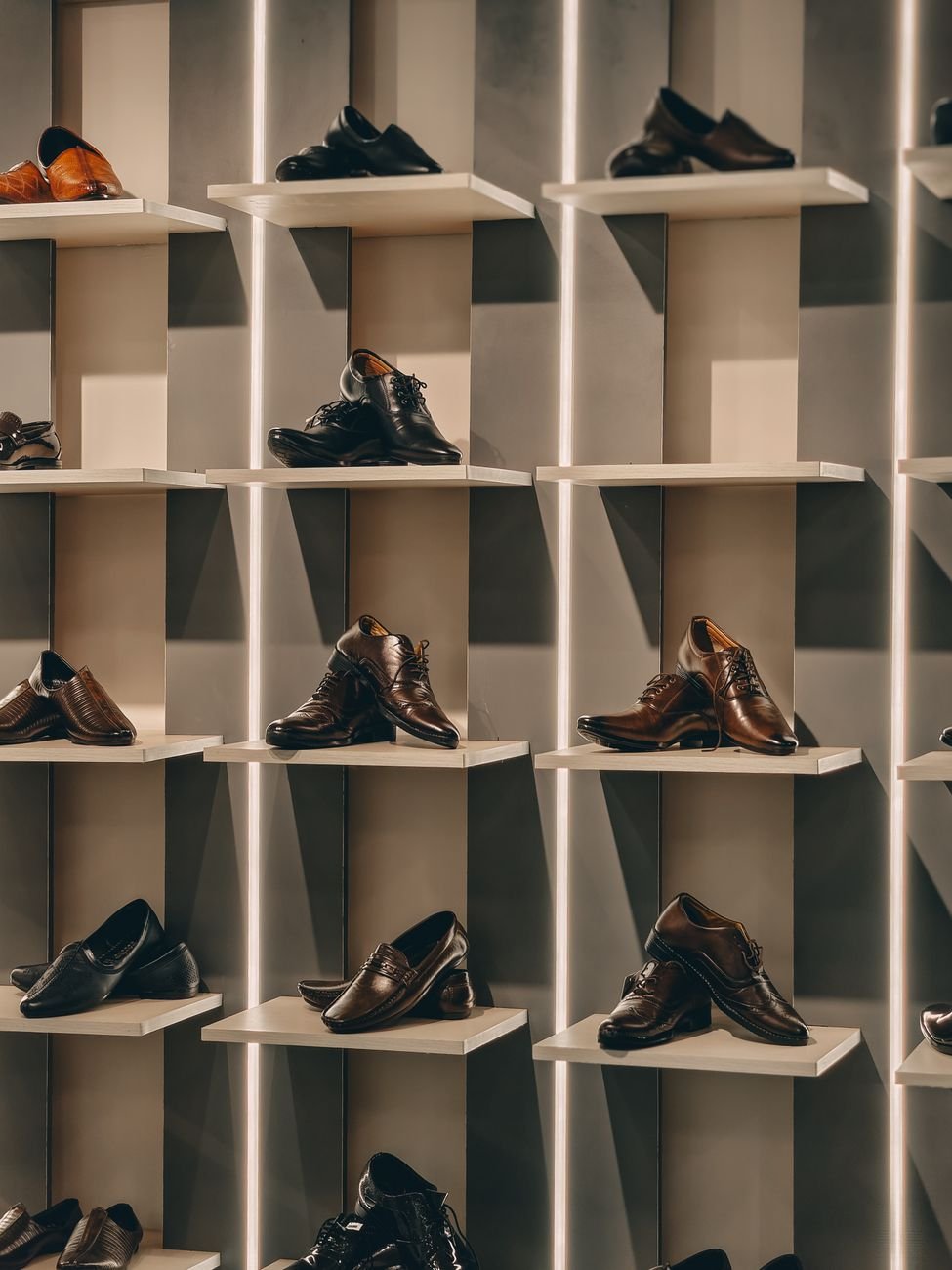 Shoes lined up neatly in closet cubbies