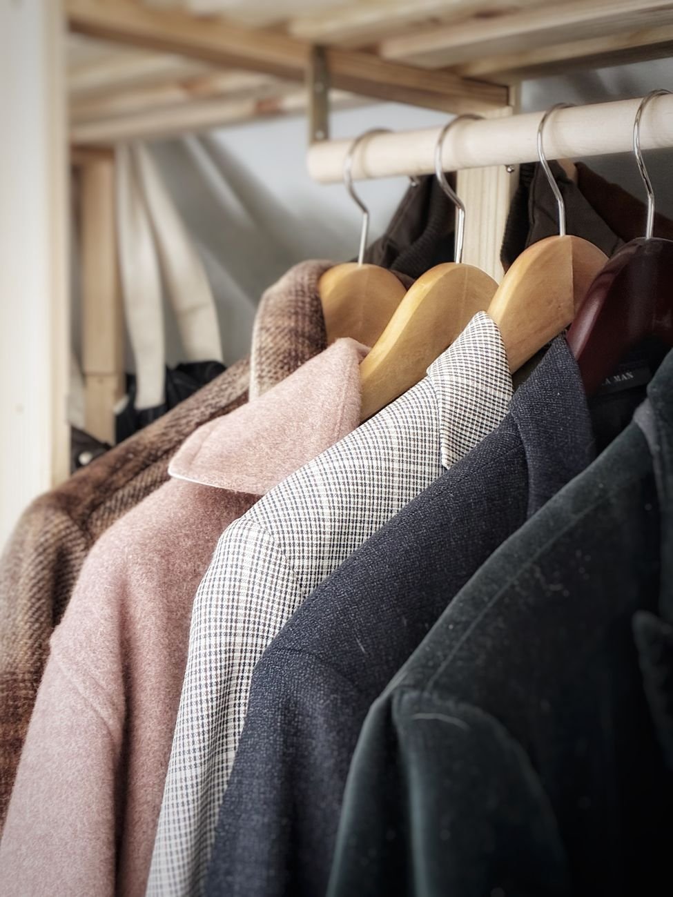 Winter coats and jackets hanging in a closet