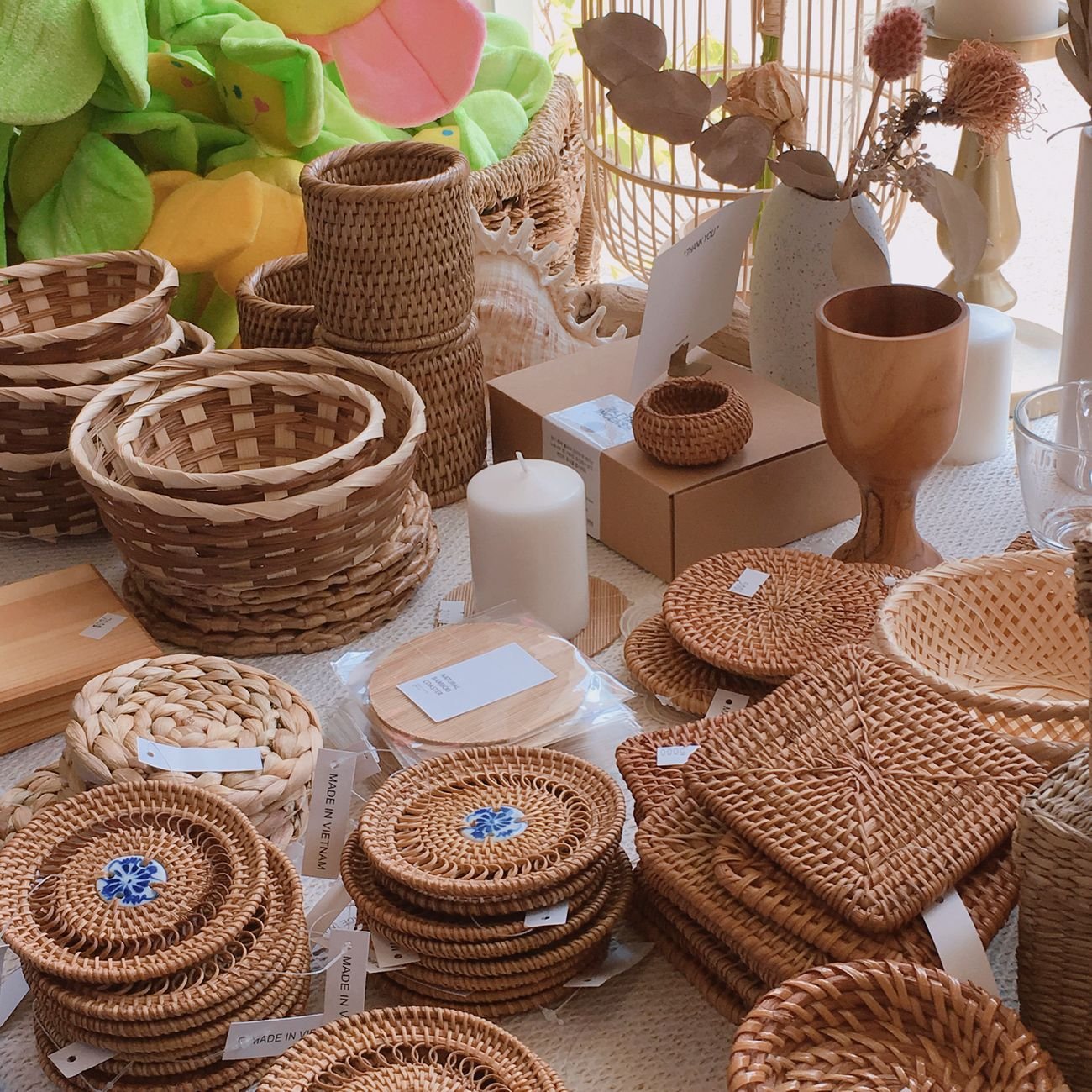 Woven baskets on a closet shelf holding hats and gloves