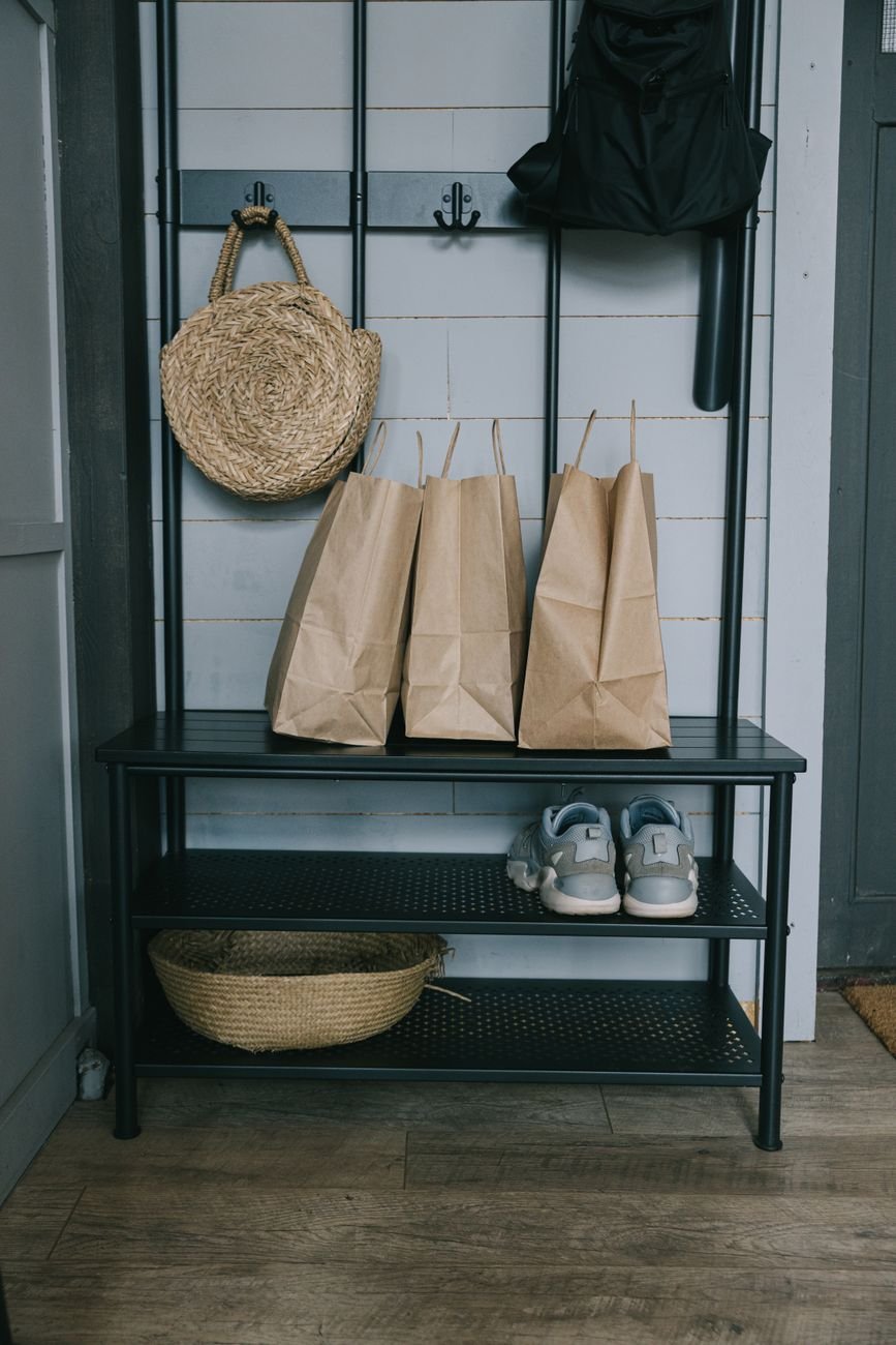 Shoes and bags tidied by the front door