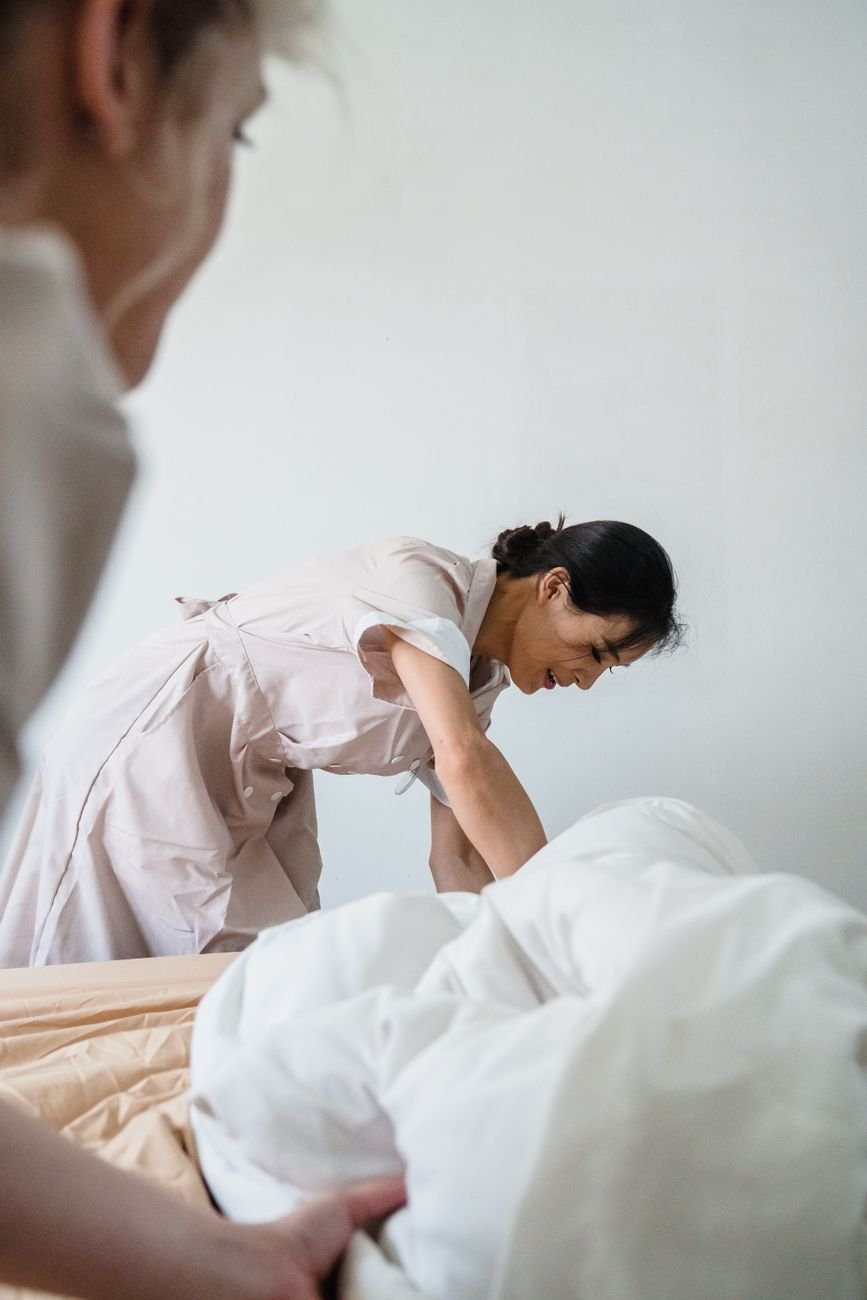 A freshly made bed with clean white sheets