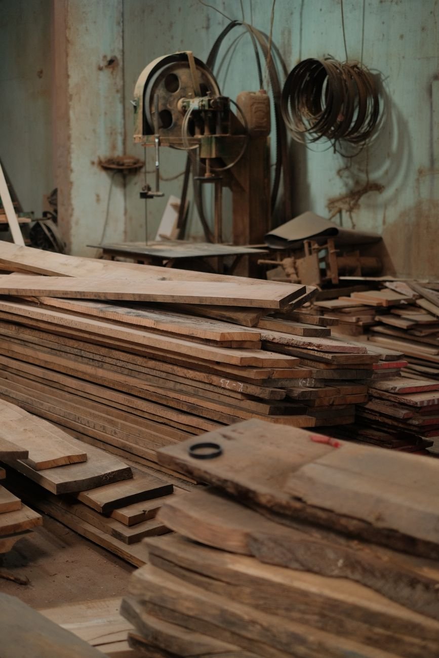 Wooden boards and woodworking tools on a workbench