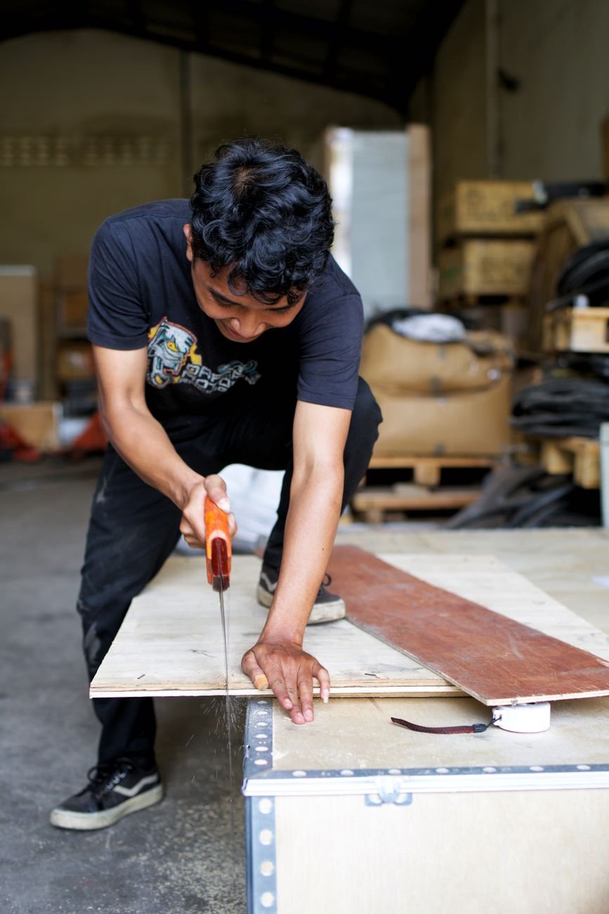 Plywood boards and woodworking tools on a workbench