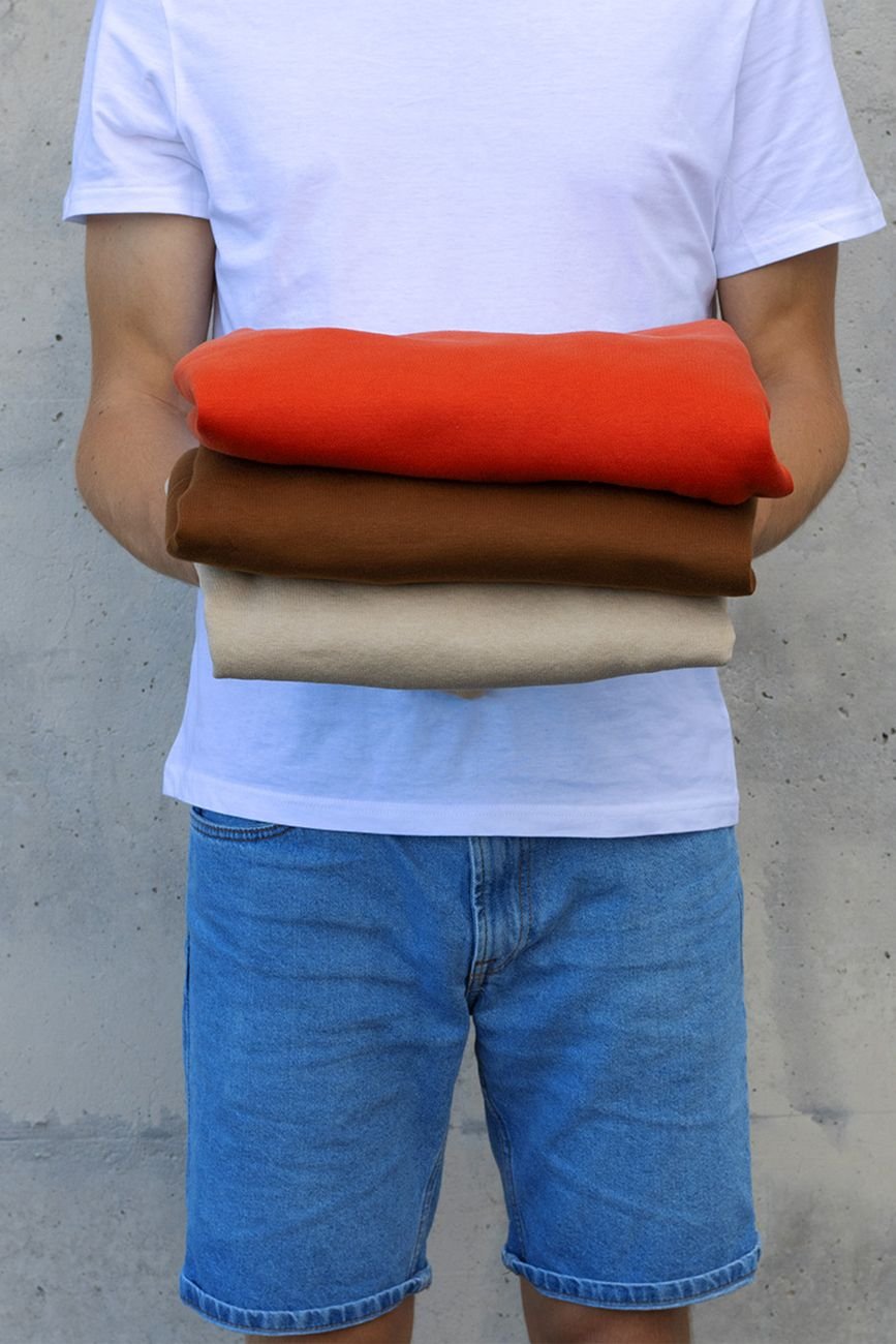 A pile of old T-shirts and fleece ready to be cut into strips