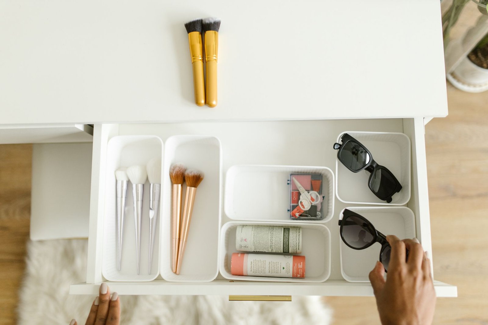 A neatly organized kitchen drawer with dividers and utensils