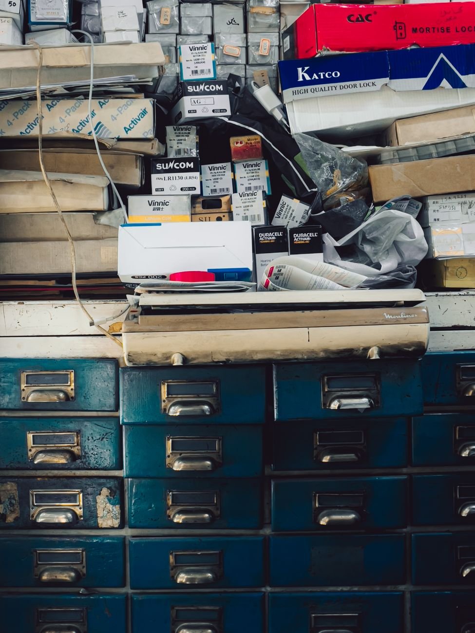 A cluttered drawer full of random odds and ends