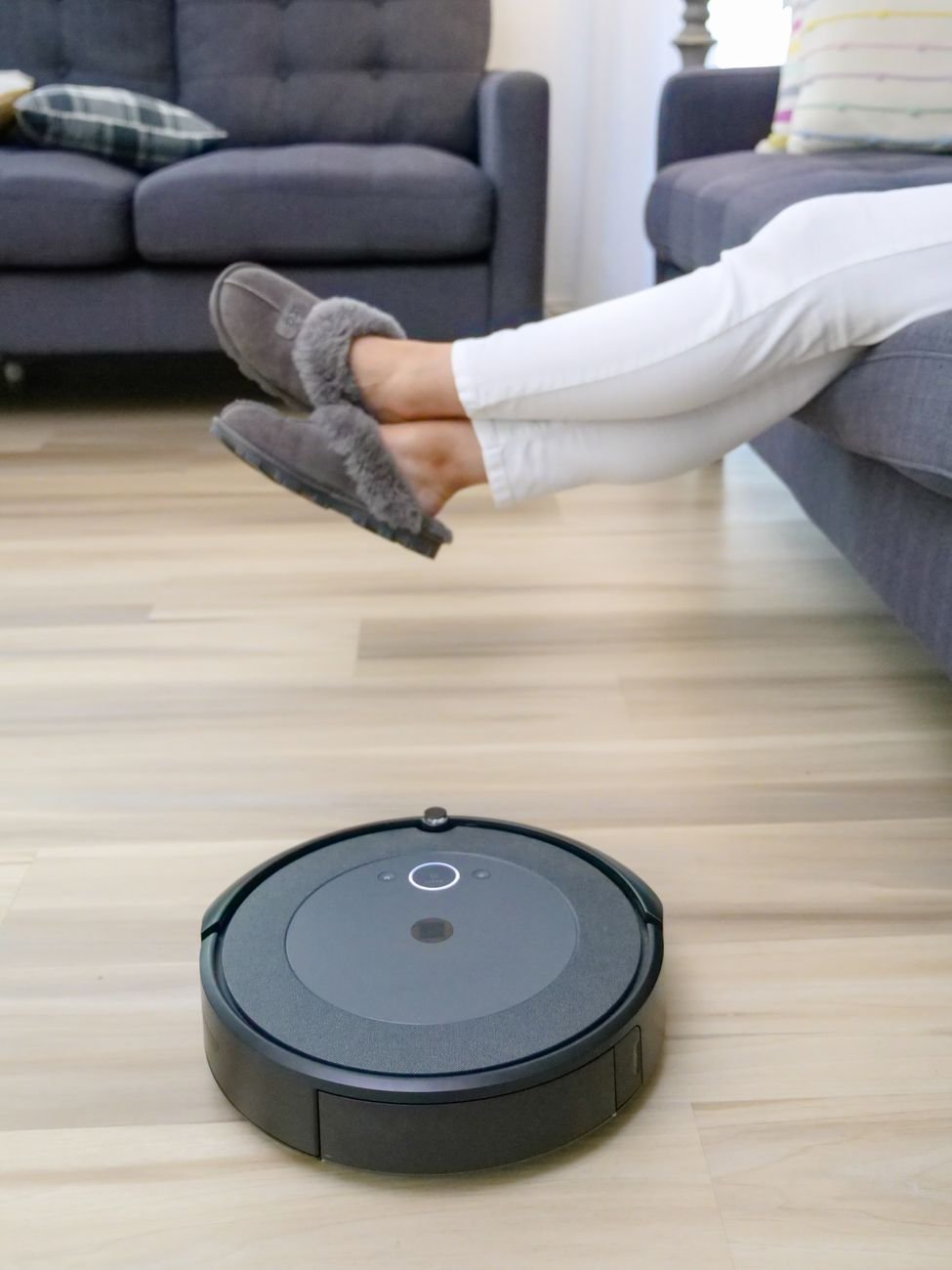 A robot vacuum cleaning a wood floor
