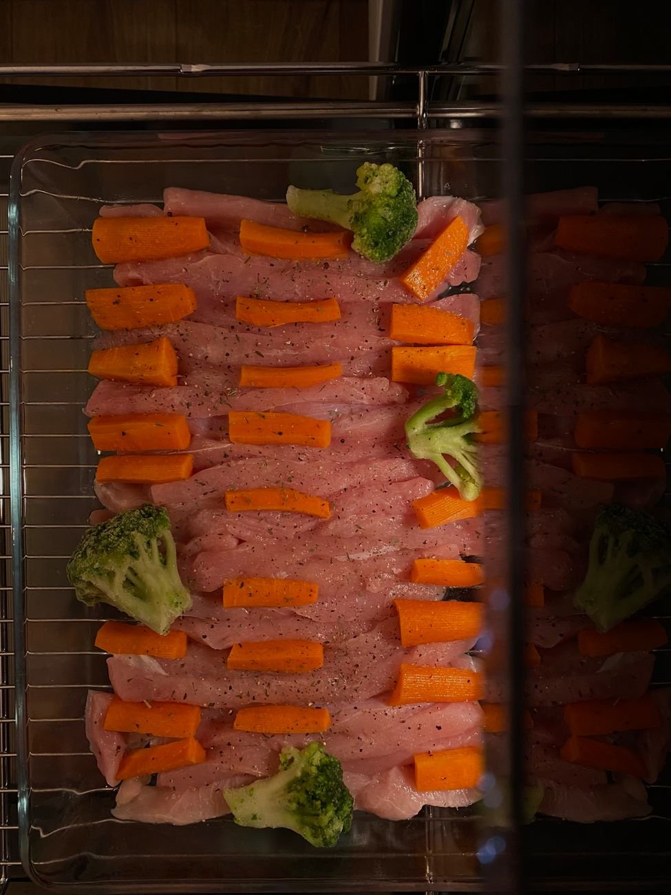 Raw meat on a tray ready for the bottom shelf