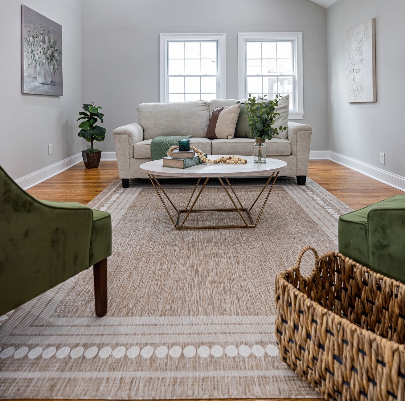 A bright, tidy living room with a basket and open space
