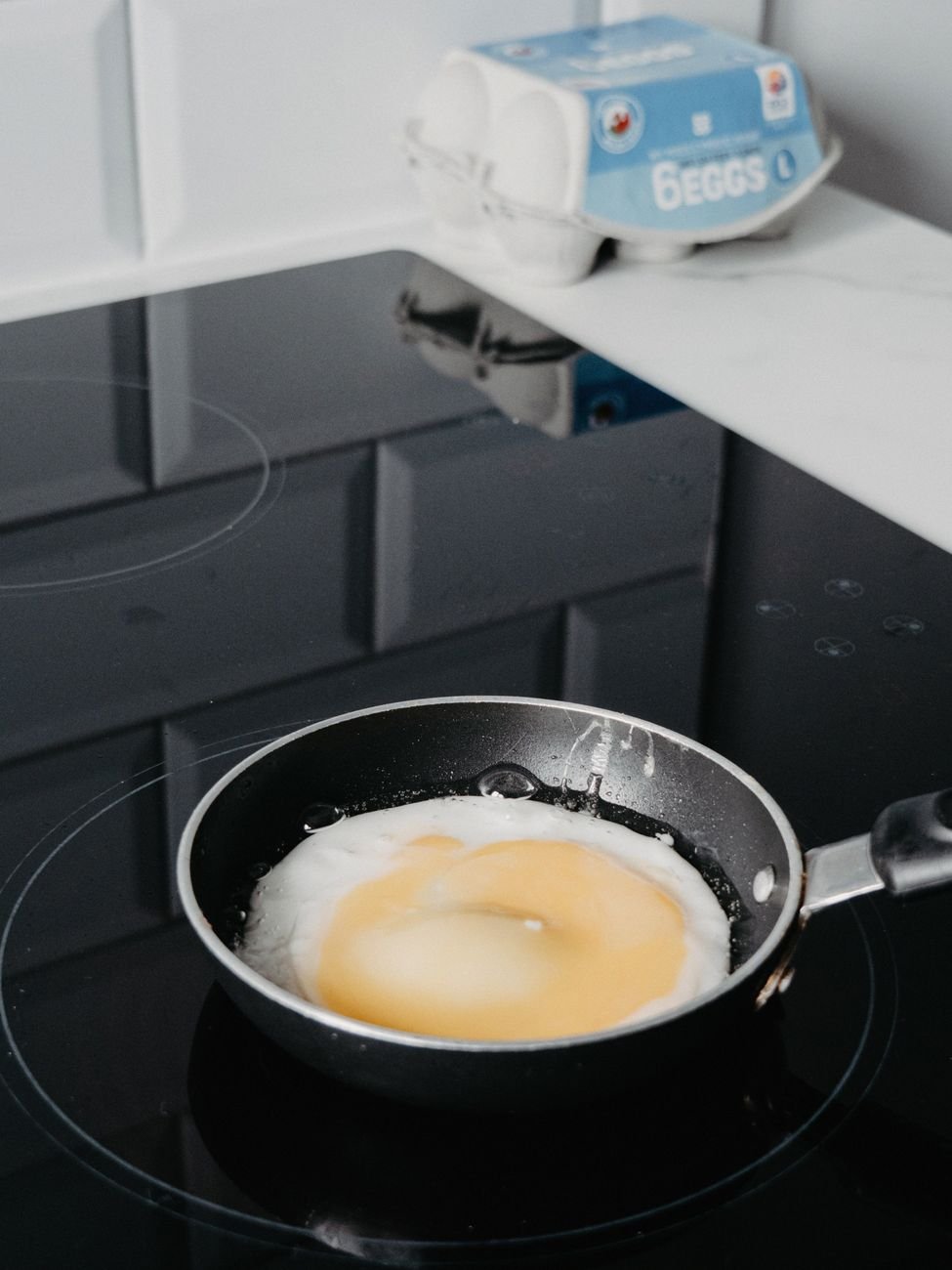 Plain scrambled eggs in a pan with no seasoning