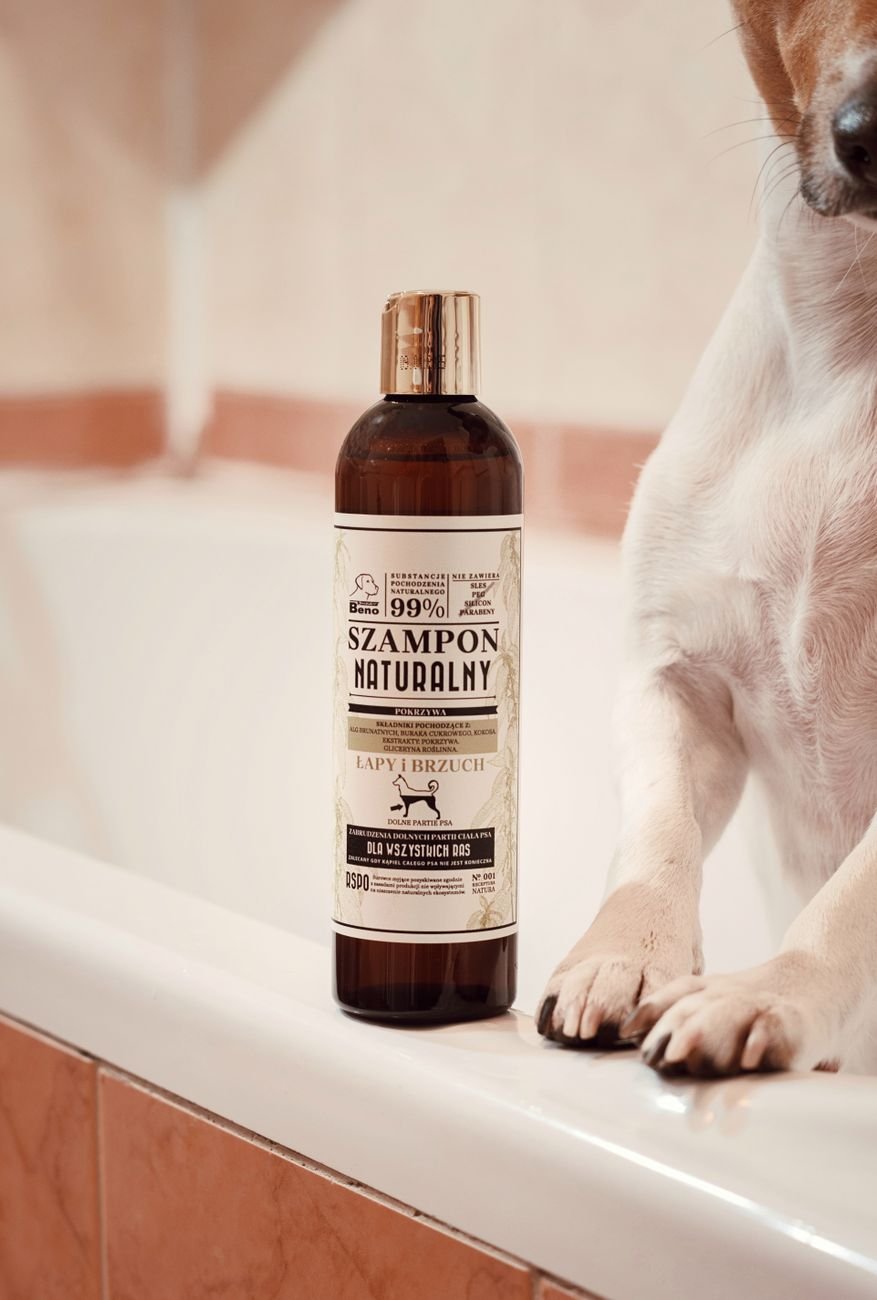 A bottle of dog shampoo by the tub