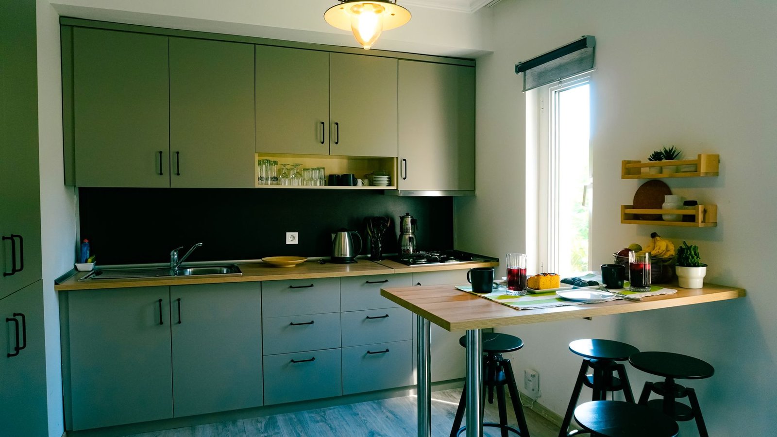 A bright, tidy kitchen with clear counters and neatly arranged shelves