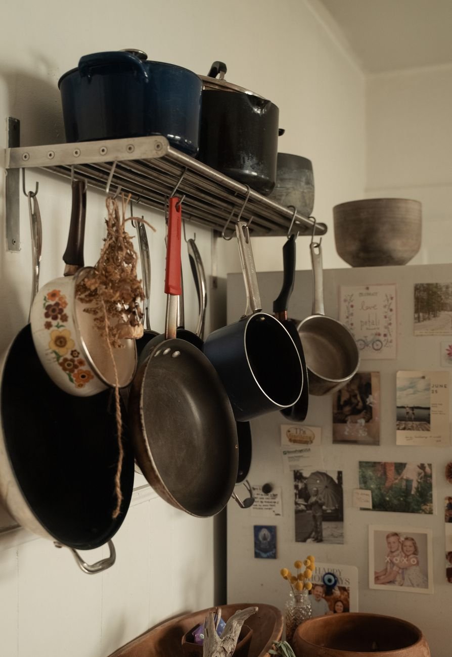 Pots and pans stored in a deep kitchen drawer