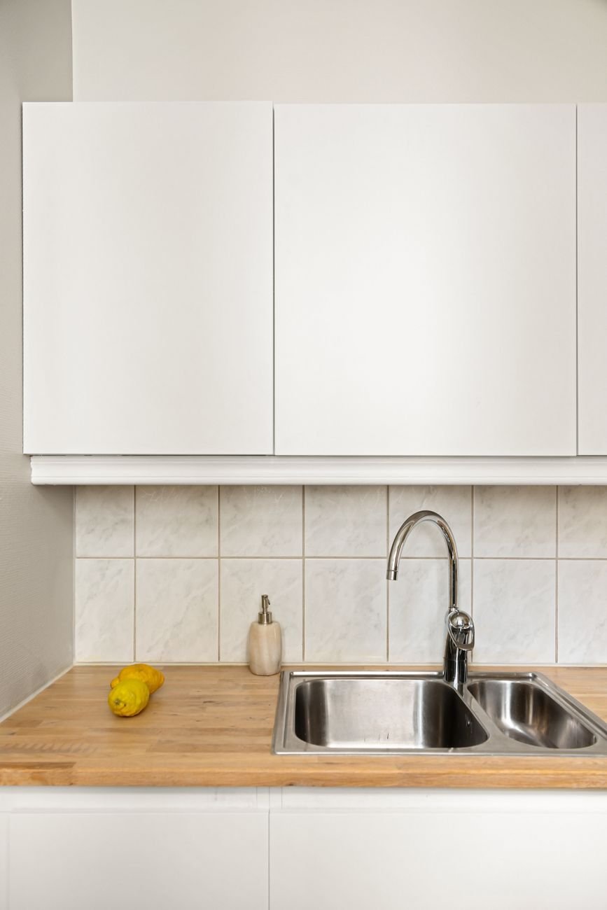 A clear kitchen countertop with only a few everyday items