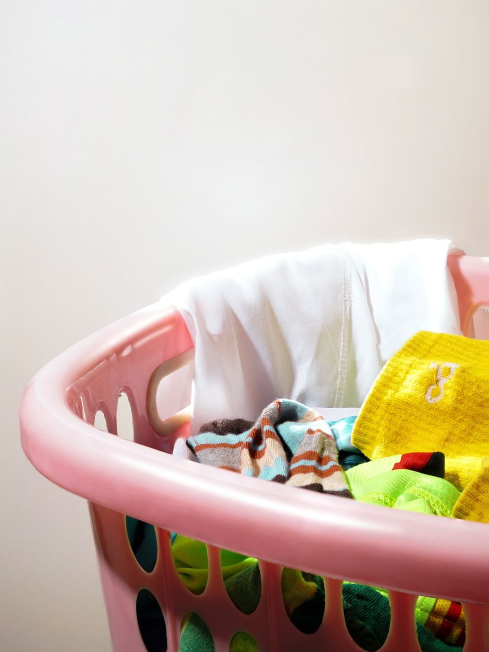 Laundry baskets filled with clothes ready to sort