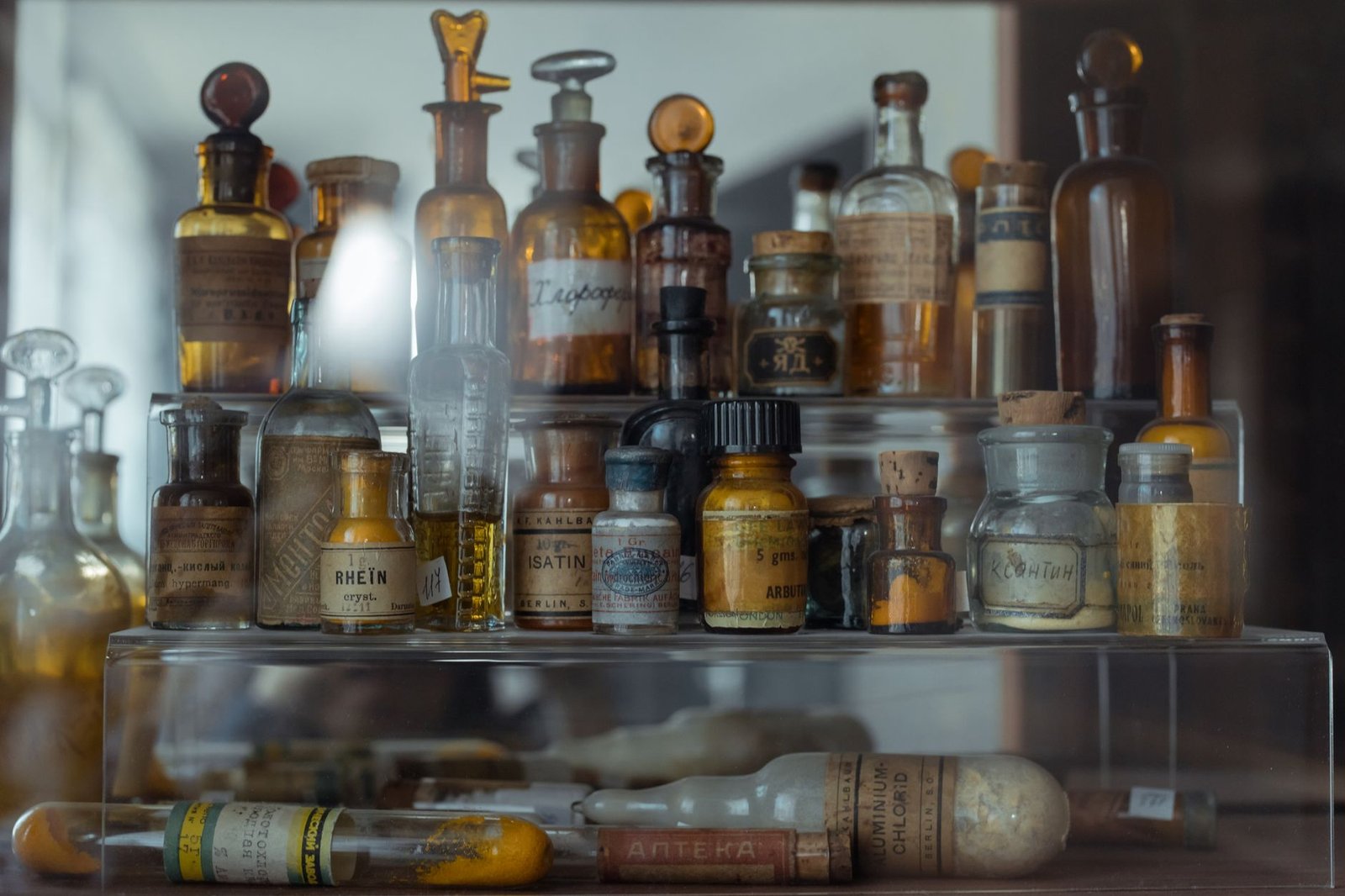 Neatly organized medicine bottles and first aid supplies on a shelf
