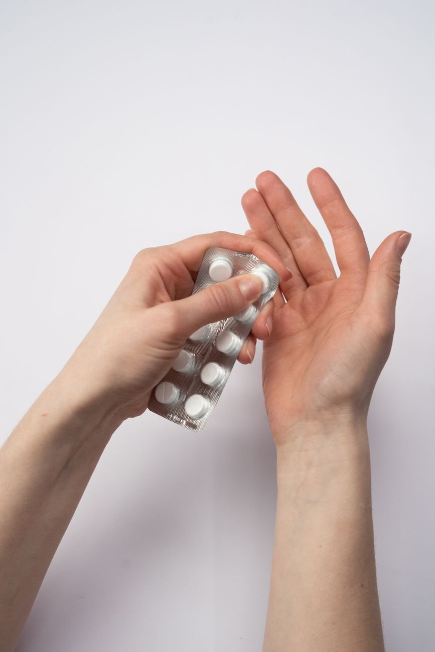 Checking the expiration date on a medicine package