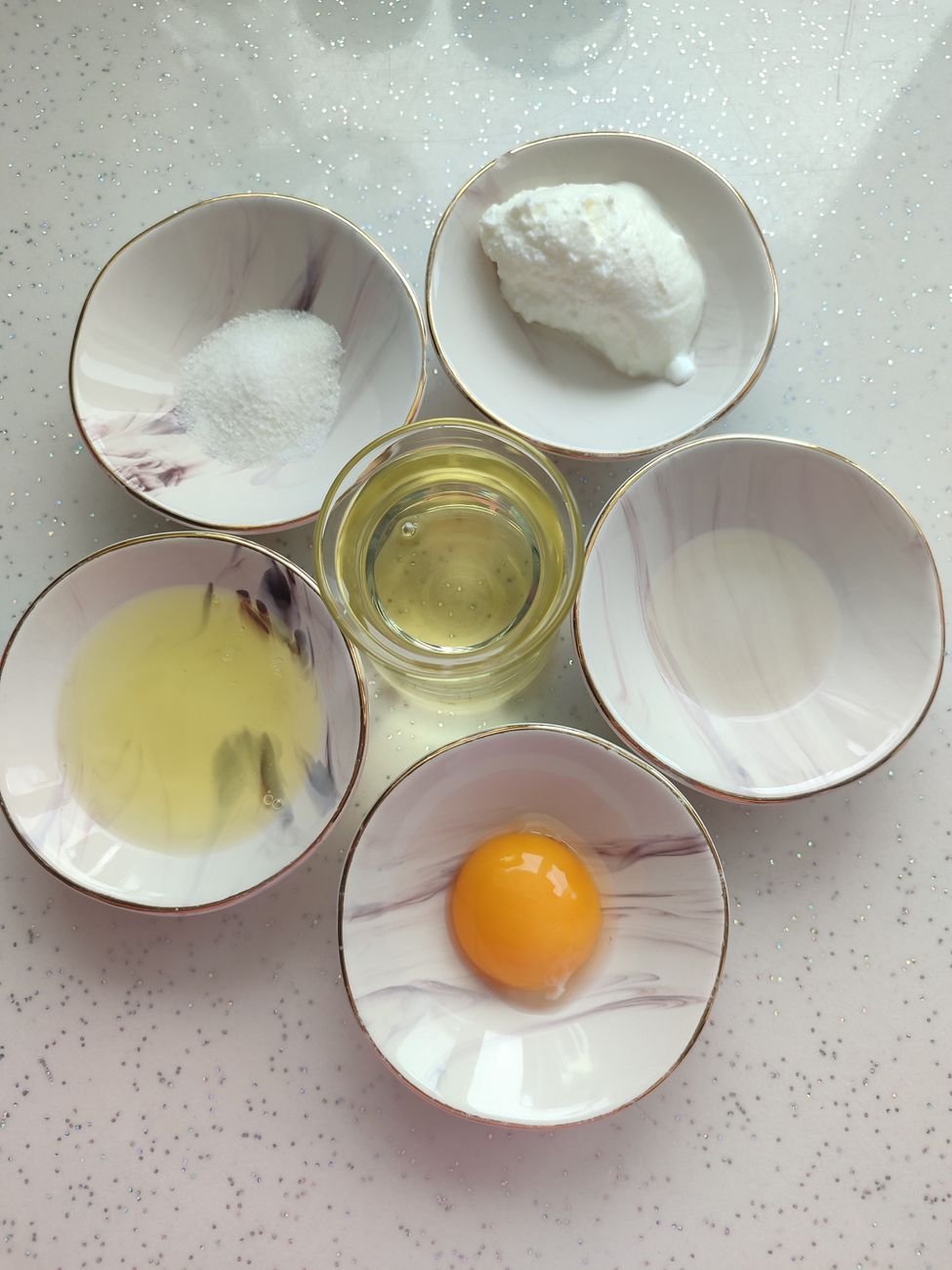 A box of baking soda and a small bowl on the counter