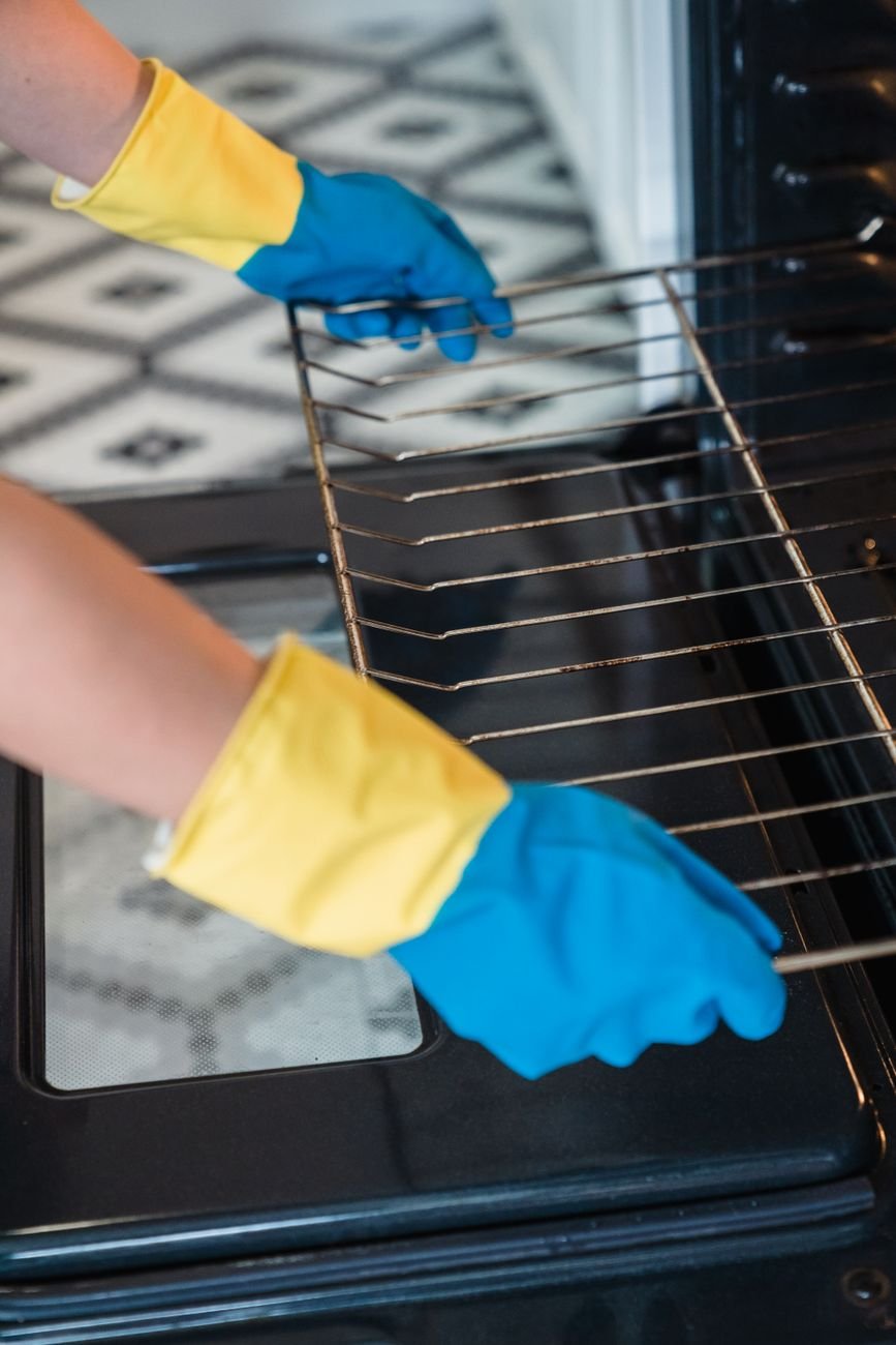 Oven racks soaking in soapy water
