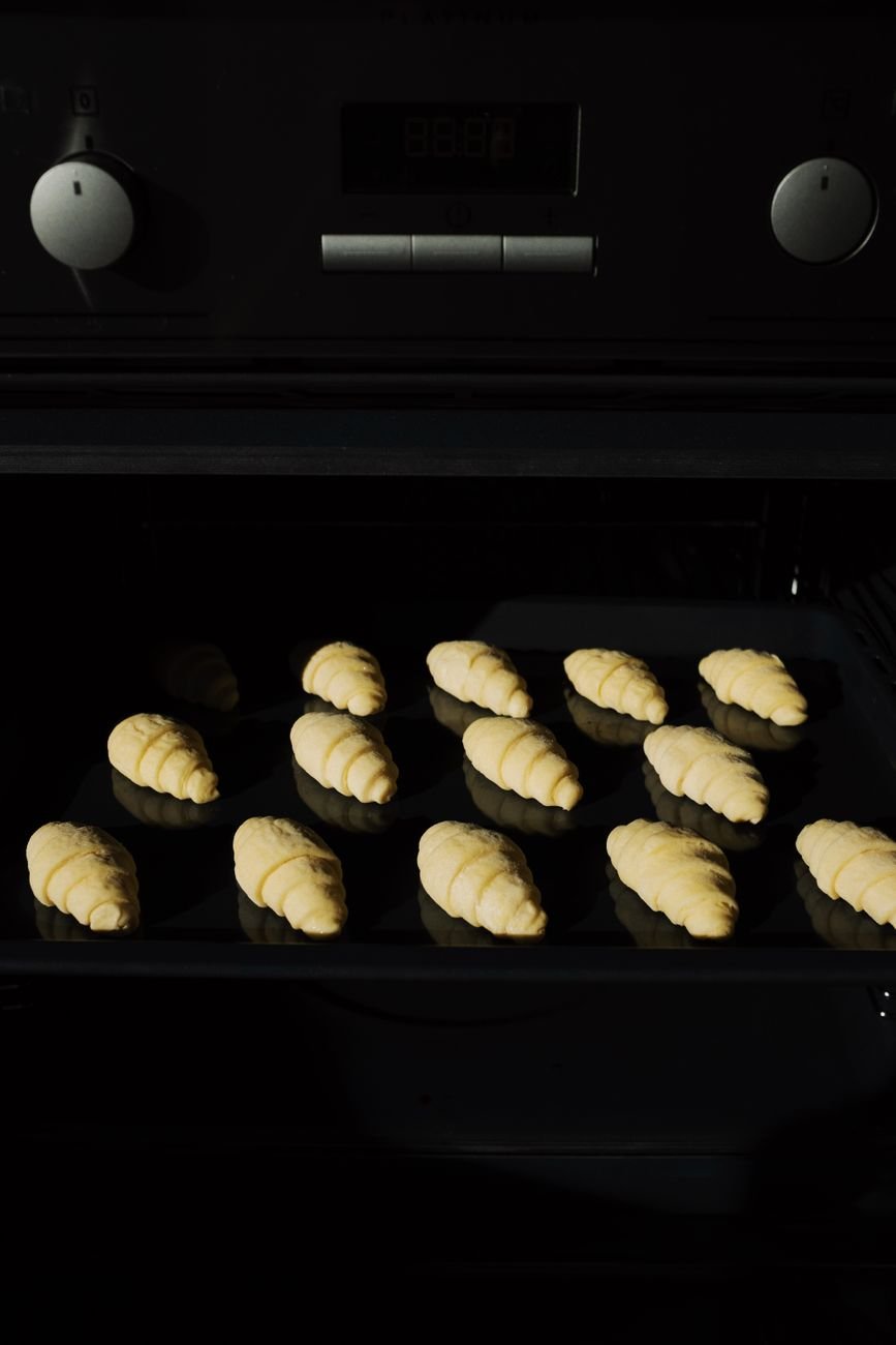 A tray of food baking inside a clean oven