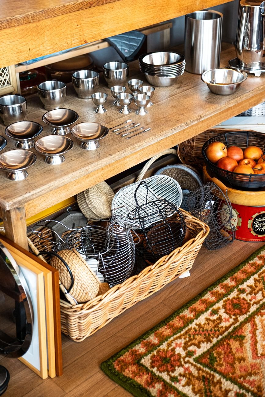 Woven baskets holding snacks on a pantry shelf
