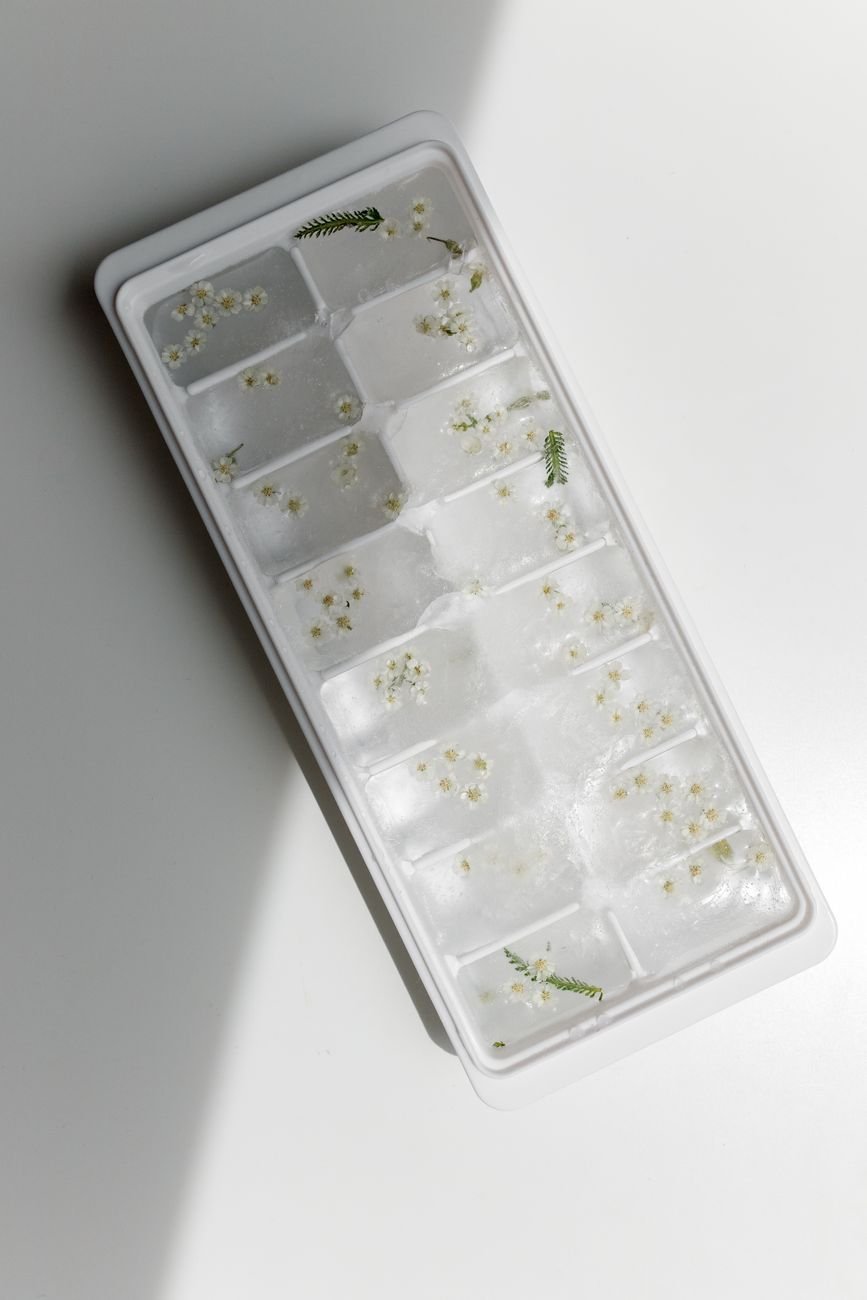 Silicone molds and an ice cube tray ready to fill