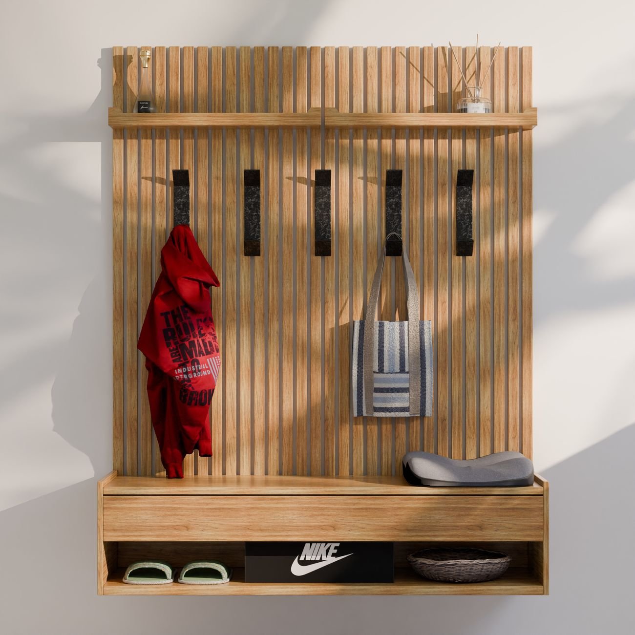 Hooks on a wall holding bags and a jacket
