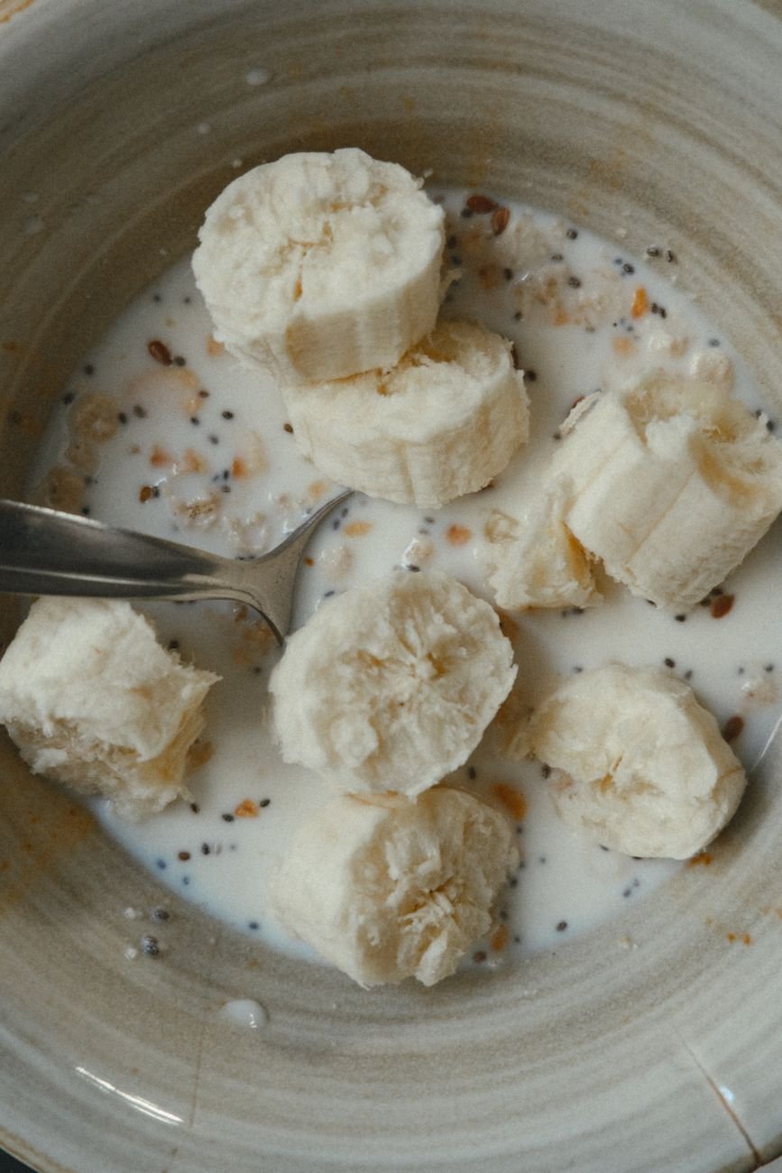 Ripe bananas and rolled oats on a table