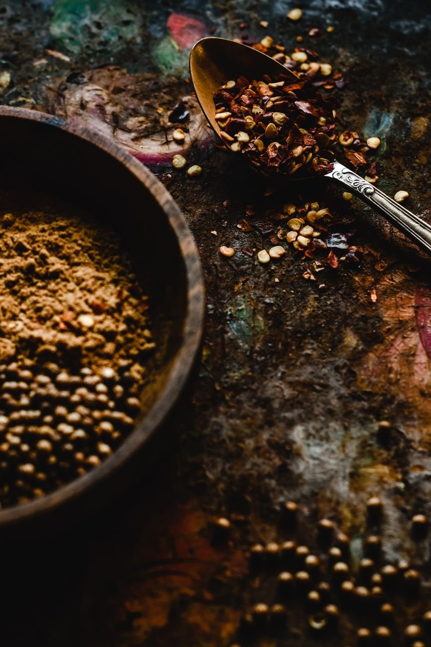 Colorful ground spices in small bowls