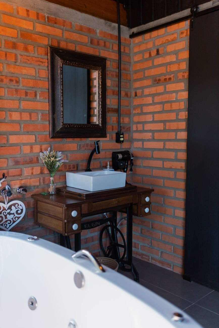 A bathroom vanity with a sink and cabinet doors