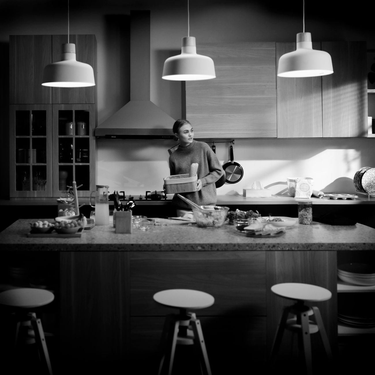 A person wiping down a kitchen counter